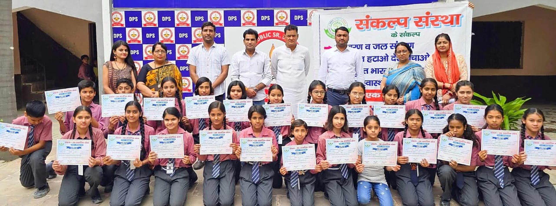 Sankalp Sanstha team with students holding certificates